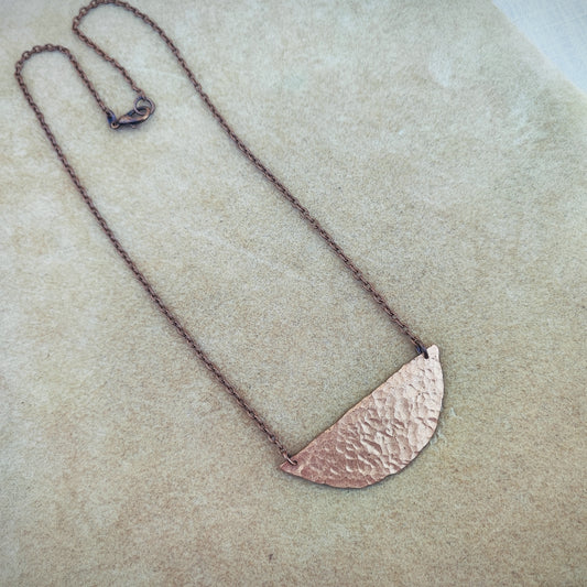 Copper geometrical necklace.